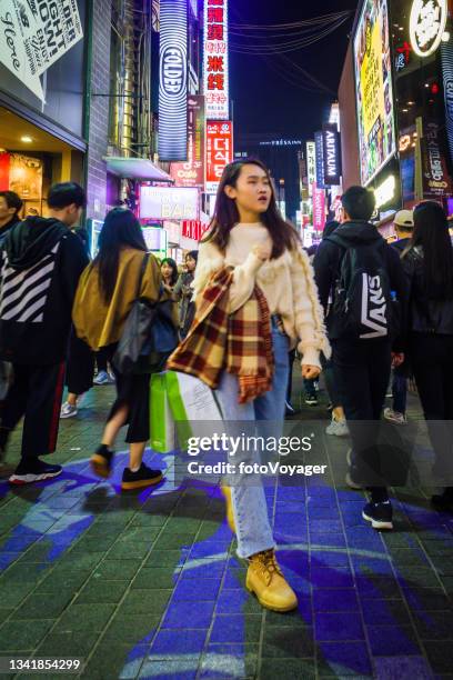 seoul teenagers in busy myeong-dong shopping district at night korea - korean teen bildbanksfoton och bilder