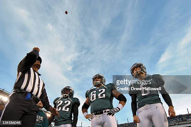 Asante Samuel, Jason Kelce, and Alex Henery of the Philadelphia Eagles watch the coin toss during the game against the New England Patriots at...