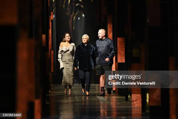Fashion designers Delfina Delettrez-Fendi, Silvia Venturini Fendi and Kim Jones acknowledge the applause of the audience at the Fendi fashion show...