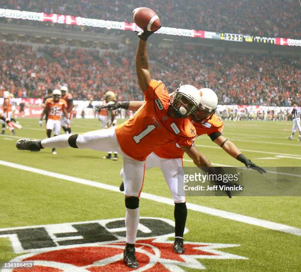 Arland Bruce and Andrew Harris of the BC Lions celebrate fourth-quarter touchdown against the Winnipeg Blue Bombers during the CFL 99th Grey Cup...