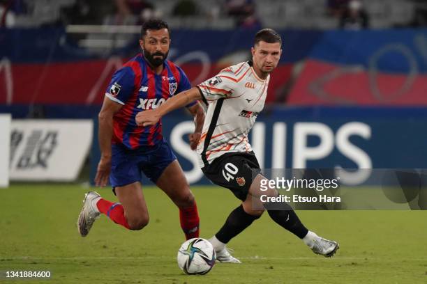 Jakub Swierczok of Nagoya Grampus and Joan Oumari of FC Tokyo compete for the ball during the J.League Meiji Yasuda J1 match between FC Tokyo and...