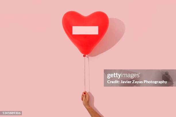 forbidden to fall in love - child love heart hands stockfoto's en -beelden