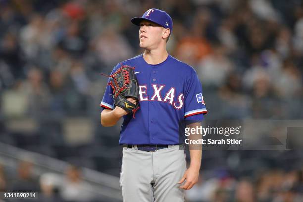 Kolby Allard of the Texas Rangers looks on while pitching during the third inning against the New York Yankees at Yankee Stadium on September 21,...