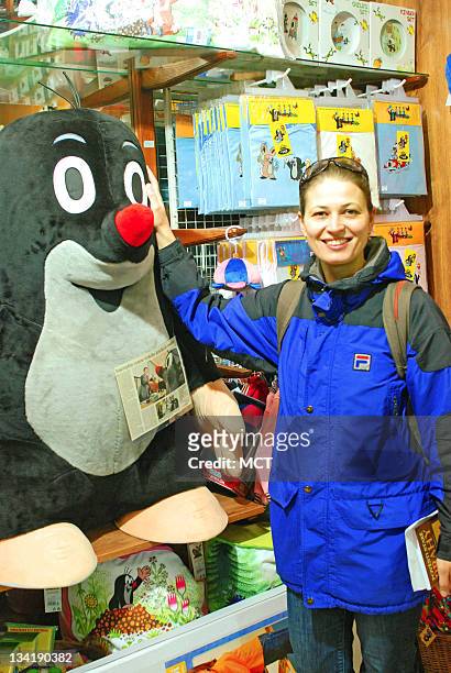 Monika Ruzickova poses for portrait with a big stuffed Little Mole.