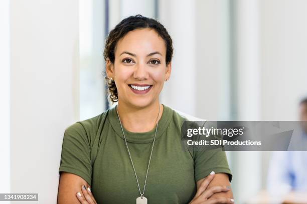 photo of smiling female soldier taking break - militar imagens e fotografias de stock