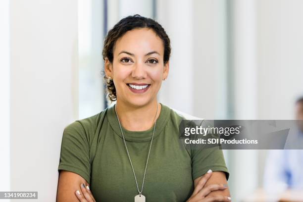 photo of smiling female soldier taking break - recruiter bildbanksfoton och bilder