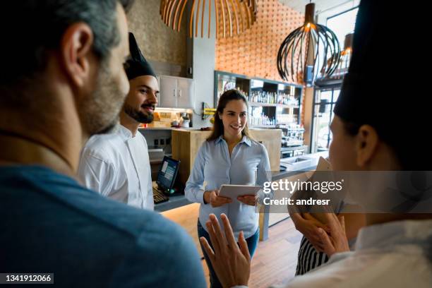 staff meeting at a restaurant - essential services employees stock pictures, royalty-free photos & images