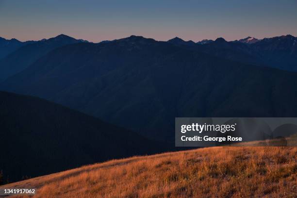 Sunrise is viewed from the Hurricane Ridge Visitor Center vista point, a popular destination overlooking the entire Olympic Mountain Range, on...