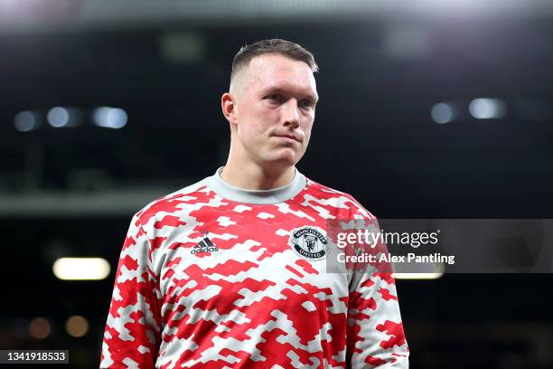 Phil Jones of Manchester United looks on during the warm up prior to the Carabao Cup Third Round match between Manchester United and West Ham United...