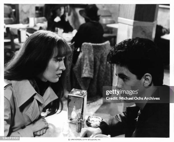 Susan Kendall Newman sitting at a diner with Bobbie Di Cicco in a scene from the film 'I Want To Hold Your Hand', 1978.