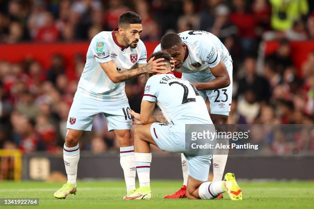 Manuel Lanzini celebrates with teammates Issa Diop and Ryan Fredericks of West Ham United after scoring their team's first goal during the Carabao...