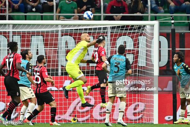 Niki Maenpaa of Venezia FC makes a save against Brahim Diaz of AC Milan during the Serie A match between AC Milan and Venezia FC at Stadio Giuseppe...