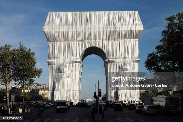 The Arc de Triomphe wrapped in a giant sheet of fabric as part of a project of late Bulgarian-born US artist Christo Javacheff is seen on September...