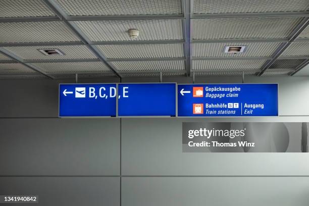 information signs at the airport - frankfurt international airport stock pictures, royalty-free photos & images