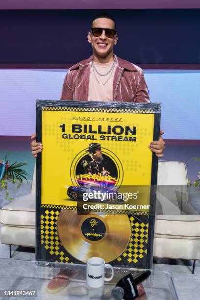 Daddy Yankee receives an award for One Billion Global Streams of his single "Problema" during Billboard Latin Music Week 2021 at Faena Forum on...