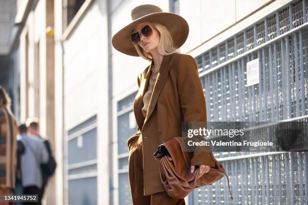 Elizabeth Sulcer poses ahead of the Alberta Ferretti fashion show wearing Alberta Ferretti during the Milan Fashion Week - Spring / Summer 2022 on...