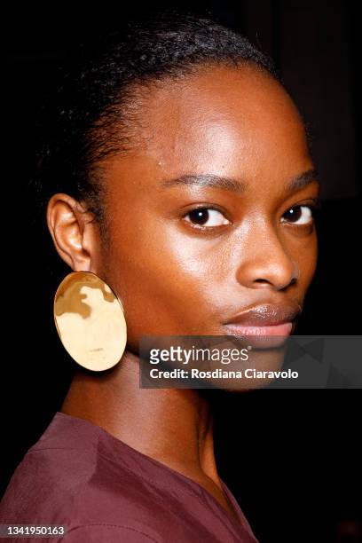 Model Mayowa Nicholas poses in the backstage of the Jil Sander fashion show during the Milan Fashion Week - Spring / Summer 2022 on September 22,...