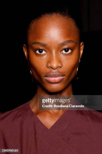 Model Mayowa Nicholas poses in the backstage of the Jil Sander fashion show during the Milan Fashion Week - Spring / Summer 2022 on September 22,...