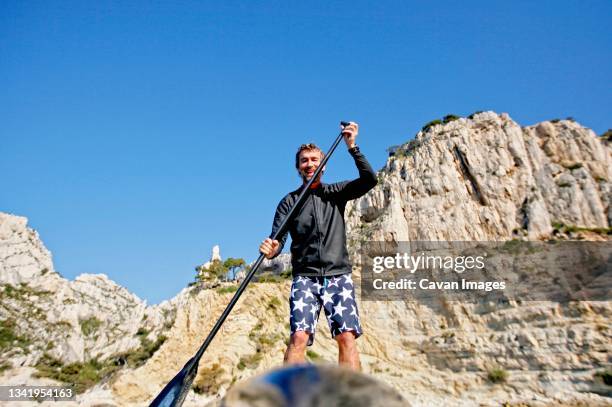 stroll, stand up paddle, and sip along the marseille calanques. - calanques stock pictures, royalty-free photos & images