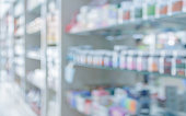 pharmacy drugstore shelves interior blurred abstract background