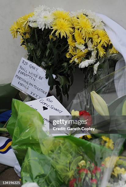 Flowers with cards are left at the Billy Bremner statue outside Elland Road football ground in memory of former player Leeds United Gary Speed on...