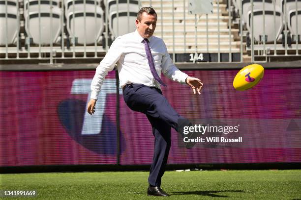 Premier Mark McGowan has a kick to kick with AFL CEO Gillon McLachlan during a media opportunity ahead of the 2021 AFL Grand Final at Optus Stadium...