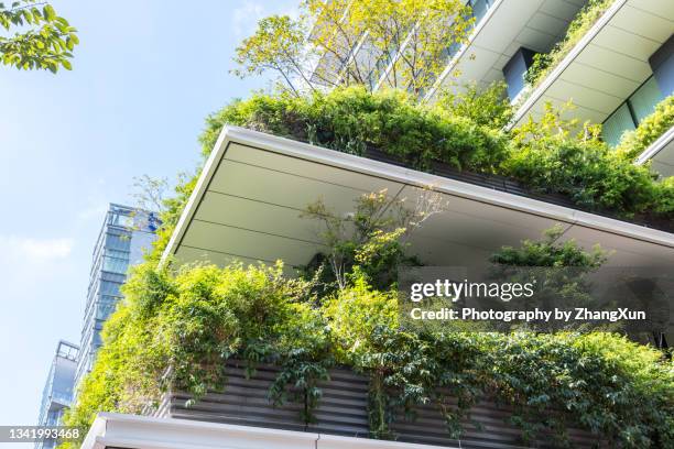 tokyo skyline of skyscrapers with greens at day time. - futuristic home stock pictures, royalty-free photos & images