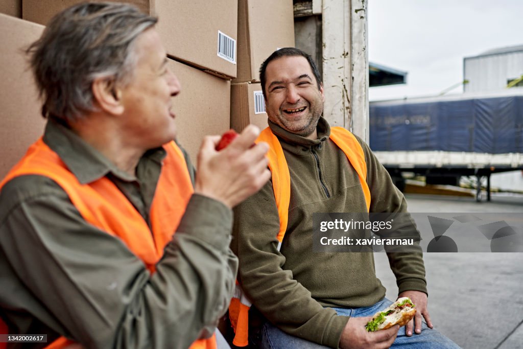 Male Truck Drivers Enjoying Outdoor Lunch Break
