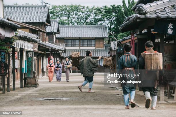 people walking in edo period town - edo period stock pictures, royalty-free photos & images