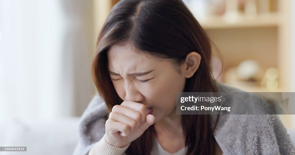 Asian woman cough at home