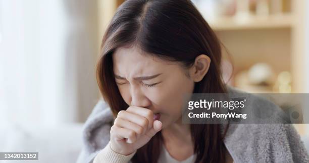 asian woman cough at home - throat pain stock pictures, royalty-free photos & images