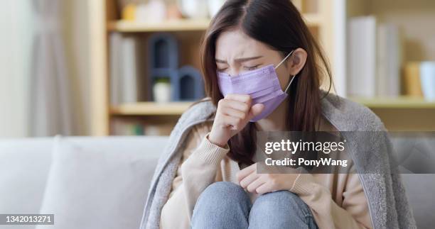 asian woman cough at home - symptom stock pictures, royalty-free photos & images