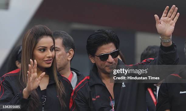 Bollywood actors Shah Rukh Khan and Bipasha Basu at the Airtel Delhi Half Marathon on November 27, 2011 in New Delhi, India.
