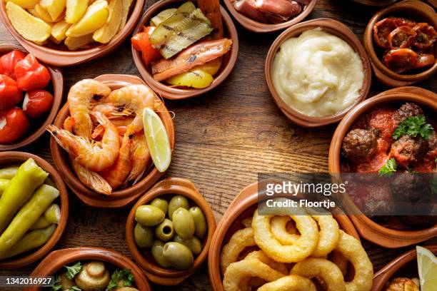 spanish food: tapas still life - patatas bravas stock pictures, royalty-free photos & images