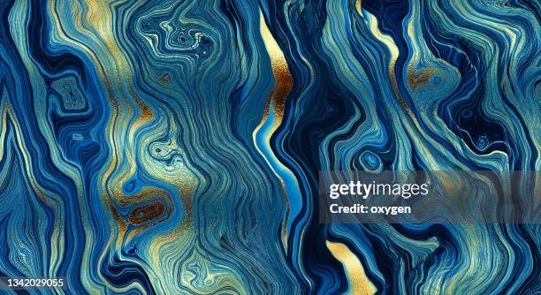 abstract golden waves on blue marbled distorted lines background. blue gold metallic texture. - golden pattern on walls stock pictures, royalty-free photos & images