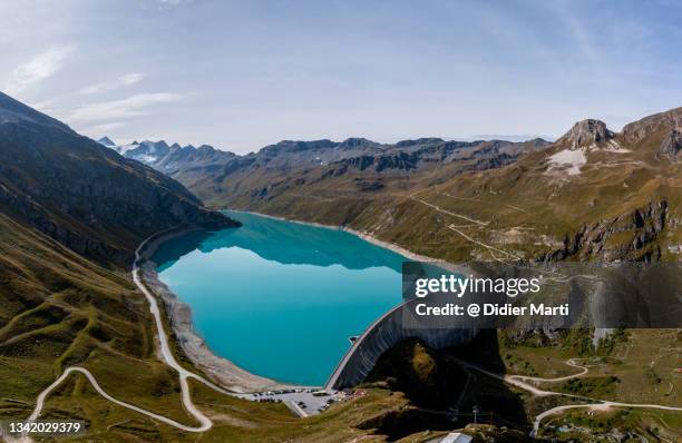 aerial view of the moiry lake and dam in the alps in canton valais in switzerland - valais canton stock pictures, royalty-free photos & images