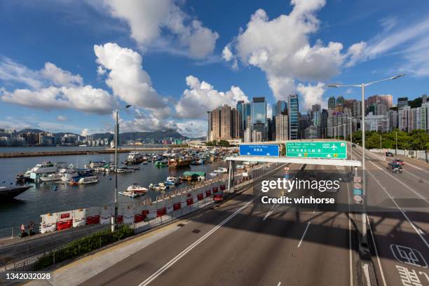 victoria park road in causeway bay, hong kong - causeway bay stock pictures, royalty-free photos & images