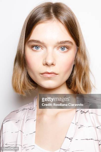 Model poses in the backstage of the Genny fashion show during the Milan Fashion Week - Spring / Summer 2022 on September 23, 2021 in Milan, Italy.