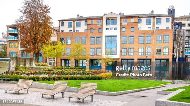 some energy efficient residential buildings near a park in the historic center of stavanger in southern norway - residential care stock pictures, royalty-free photos & images