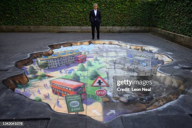Mayor of London Sadiq Khan poses with artwork by Julian Beever during a photocall at Prior Weston primary school before delivering a speech on his...