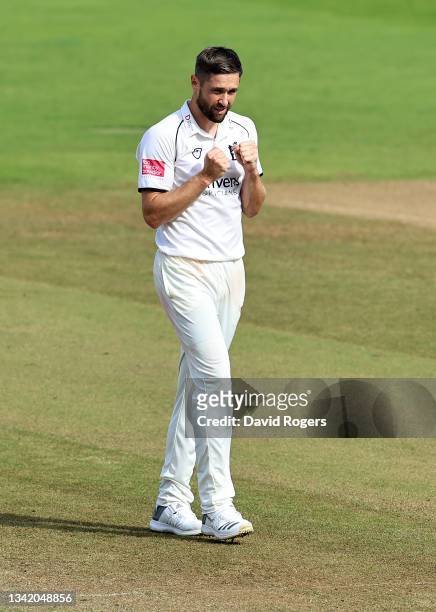 Chris Woakes of Warwickshire celebrates after taking the wicket of Lewis Gregory during day three of the LV=Insurance County Championship match...