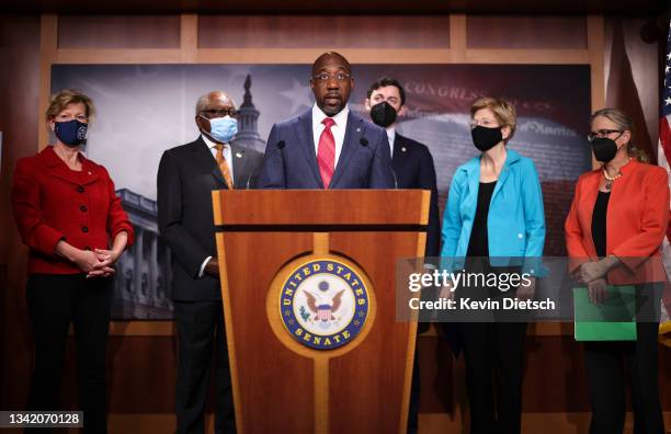 Sen. Raphael Warnock speaks on medicare expansion and the reconciliation package during a press conference with fellow lawmakers at the U.S. Capitol...