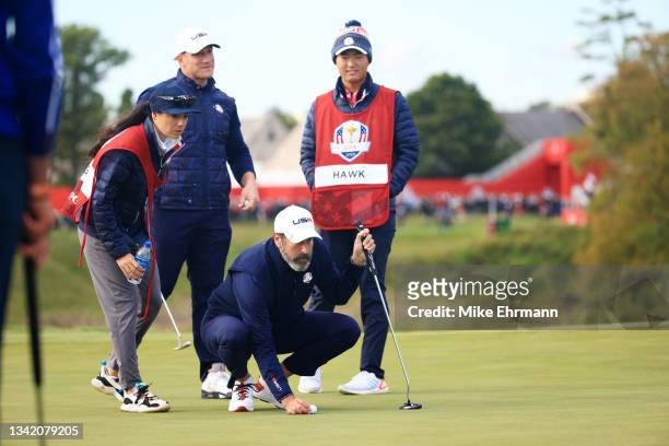 Hawk and Rob Riggle line up a putt on the 10th green during the celebrity matches ahead of the 43rd Ryder Cup at Whistling Straits on September 23,...
