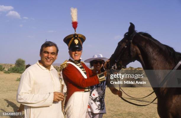 Portrait of Indian film producer Ismail Merchant and Australian actor Keith Mitchell , the latter holding a horse's reins during the filming of 'The...