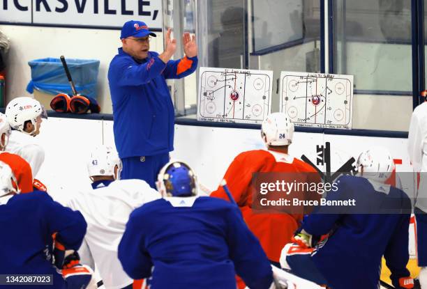 Head coach Barry Trotz of the New York Islanders conducts practice at the Northwell Health Ice Center at Eisenhower Park on September 23, 2021 in...