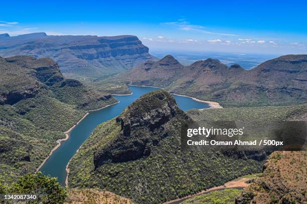 scenic view of mountains against blue sky,kruger national park,south africa - kruger national park stockfoto's en -beelden