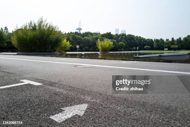 empty asphalt road in the garden - parking space stock pictures, royalty-free photos & images