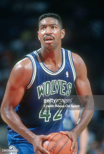 Sam Mitchell of the Minnesota Timberwolves shoots a foul shot against the Washington Bullets during an NBA basketball game circa 1989 at the Capital...