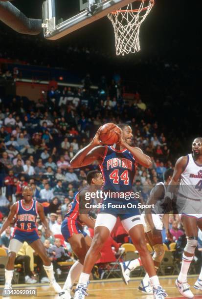 Rick Mahorn of the Detroit Pistons looks to pass the ball against the Washington Bullets during an NBA basketball game circa 1985 at the Capital...