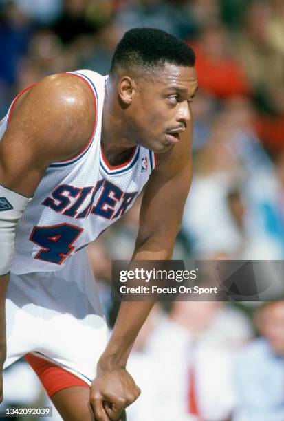 Rick Mahorn of the Philadelphia 76ers looks on against the San Antonio Spurs during an NBA basketball game circa 1990 at The Spectrum in...